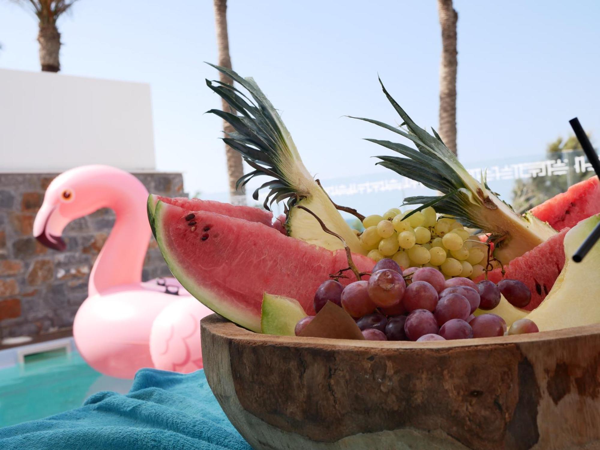 Minos Imperial Luxury Beach Resort & Spa Milatos Exterior photo A pink flamingo float